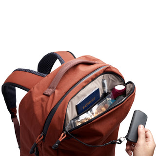Bellroy Lite Travel Pack 30L rust color with organized front compartment and visible passport pocket