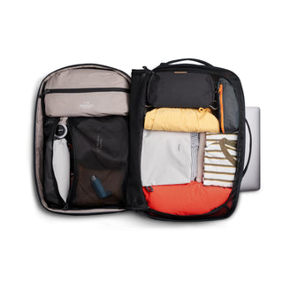 Bellroy Lite Travel Pack 38L open with organized clothes and travel accessories inside black backpack