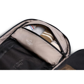 Bellroy Lite Travel Pack 38L showing organized packed interior with beige fabric and multiple compartments