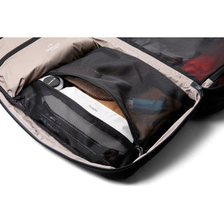 Bellroy Lite Travel Pack 38L open showing organized mesh compartments with travel essentials inside