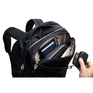 Bellroy Lite Travel Pack 38L black backpack open showing organized travel essentials inside pocket