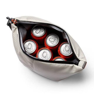 Bellroy Lite Cooler Caddy 6L in light fabric holding six red beverage cans with zippered opening