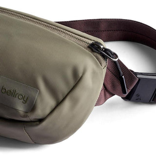 Bellroy Laneway Belt Bag in olive green with durable recycled nylon fabric and brown adjustable strap