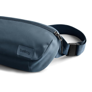 Bellroy Laneway Belt Bag in navy blue with smooth fabric and adjustable strap buckle details