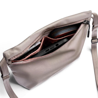 Bellroy Laneway Sacoche in taupe showing interior organization with tech and wallet storage compartments