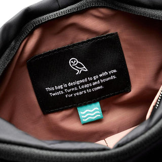 Interior label inside Bellroy Laneway Sacoche with motivational text and soft brown lining texture