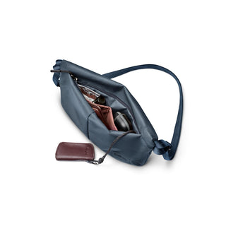Bellroy Laneway Sacoche in navy blue showing organized compartments and detachable key pouch