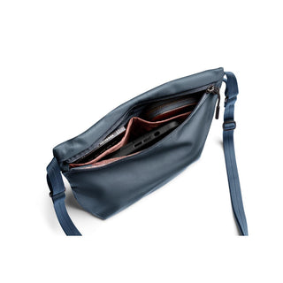 Bellroy Laneway Sacoche in navy blue showing organized interior compartments and adjustable strap