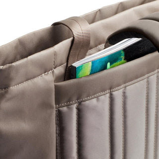 Bellroy Laneway Totepack close-up of padded beige fabric pocket holding a colorful notebook
