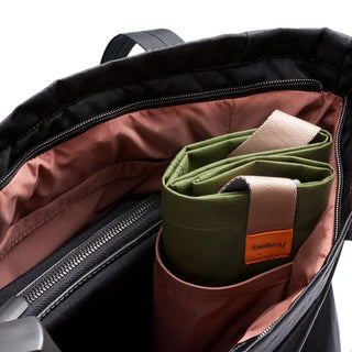 Bellroy Laneway Totepack open showing pink interior pockets and green organizer insert with beige handle