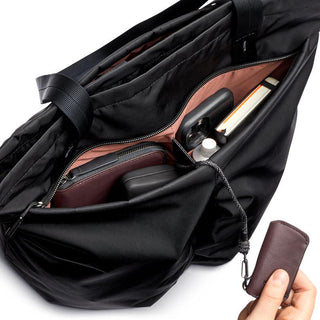 Bellroy Laneway Totepack black fabric with organized interior pockets and zip closure shown open