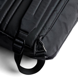 Close-up of black Bellroy Laneway Totepack strap with metal clip and recycled nylon fabric texture