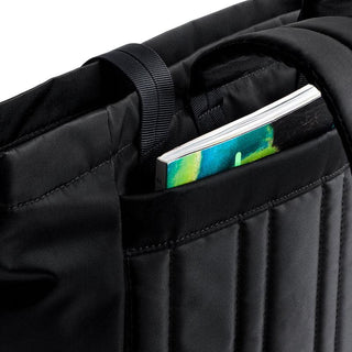 Bellroy Laneway Totepack black fabric interior pocket holding a colorful notebook upright