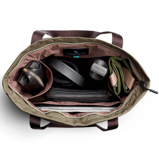 Bellroy Laneway Totepack open top showing organized interior with tech, accessories, and green fabric divider