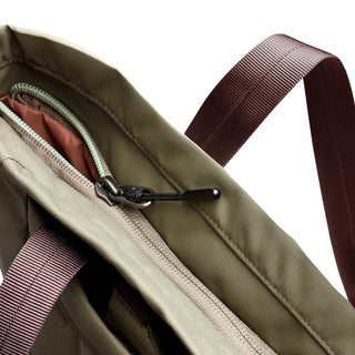 Bellroy Laneway Totepack close-up showing khaki fabric, zipper detail, and dark brown strap texture