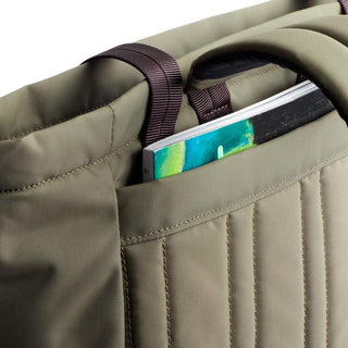 Bellroy Laneway Totepack in olive green showing padded back panel and external slip pocket with magazine.