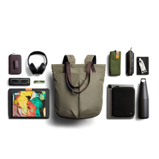 Bellroy Laneway Totepack in olive green with brown handles and everyday carry essentials arranged around it