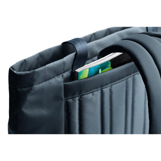 Bellroy Laneway Totepack in dark fabric showing padded back panel and external pocket with book inside