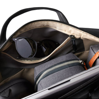 Bellroy Via Work Bag (Tech Briefcase) black interior pocket holding sunglasses and gray organizer pouch