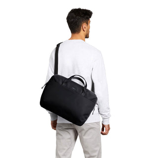 Bellroy Via Work Bag (Tech Briefcase) worn crossbody with black recycled fabric and zipper details