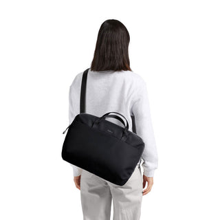 Bellroy Via Work Bag (Tech Briefcase) in black recycled fabric worn crossbody on model’s back