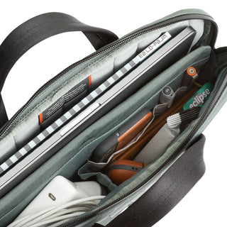 Bellroy Tokyo Laptop Bag 14" showing organized interior with laptop, charger, and accessories in recycled fabric