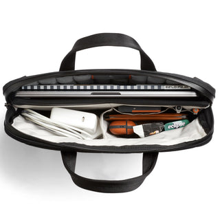 Bellroy Tokyo Laptop Bag 14" open with laptop, charger, wallet, and small items inside compartments