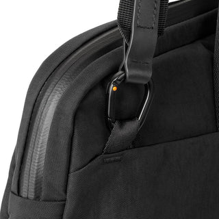 Close-up of Bellroy Tokyo Laptop Bag 16" black fabric and zipper detail with strap attachment ring
