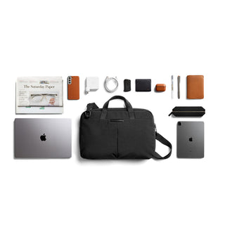 Bellroy Tokyo Laptop Bag 16" black fabric shown with laptop and tech accessories neatly arranged
