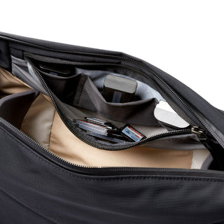 Bellroy Venture Sling 10L - Camera Edition showing organized interior pockets with camera accessories inside