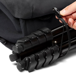 Bellroy Venture Sling 10L - Camera Edition securing a tripod with adjustable strap and black fabric detail