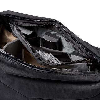 Bellroy Venture Sling 10L - Camera Edition showing organized interior compartments in black recycled fabric