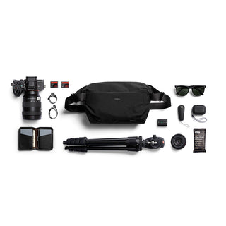 Bellroy Venture Sling 10L - Camera Edition black recycled fabric sling bag with photography gear laid out