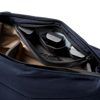 Bellroy Venture Sling 10L - Camera Edition showing organized interior compartments in navy blue material