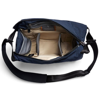Bellroy Venture Sling 10L - Camera Edition navy bag open showing padded beige interior compartments and adjustable strap
