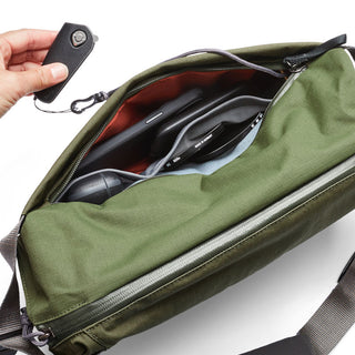 Bellroy Venture Sling 10L - Camera Edition in olive green shows organized interior compartments and strap attachment
