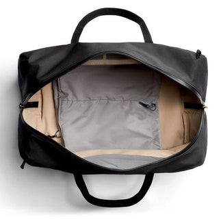 Bellroy Venture Duffel 55L with spacious beige interior and black recycled fabric exterior visible from top angle