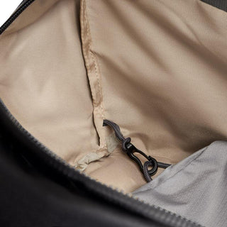 Bellroy Venture Duffel 55L interior with beige lining and secure clip attachment detail