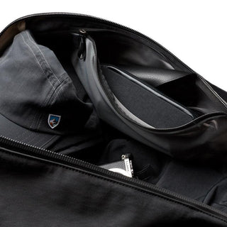 Bellroy Venture Duffel 55L open interior showing organized compartments with travel essentials inside
