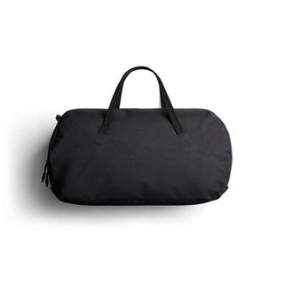 Bellroy Venture Duffel 55L in black recycled nylon fabric with top handles and minimalist design