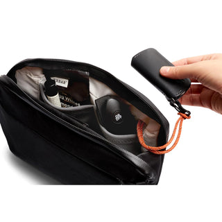 Bellroy Venture Travel Crossbody in black with organized interior and leather key holder attached