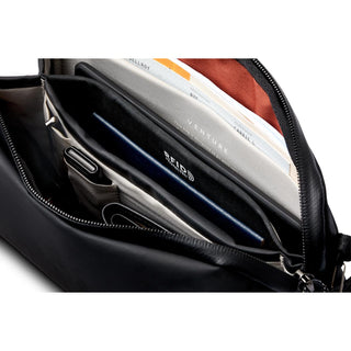Bellroy Venture Travel Crossbody showing organized interior with multiple compartments and RFID protection pocket