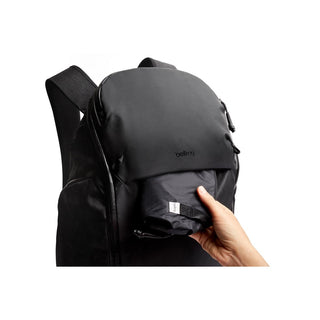 Bellroy Venture Travel Pack 26L black backpack showing compact foldable item in front pocket