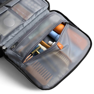 Bellroy Hanging Toiletry Kit Plus open showing organized mesh compartments and travel essentials inside