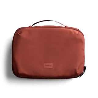 Bellroy Hanging Toiletry Kit Plus in rust fabric with sturdy handle and minimalist design
