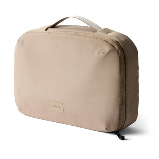Bellroy Hanging Toiletry Kit Plus in beige recycled fabric with top handle and zip closure