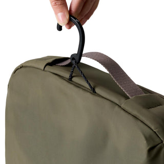 Bellroy Hanging Toiletry Kit Plus in olive green with durable fabric and attached black hanging hook