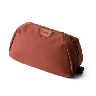 Bellroy Toiletry Kit Plus in rust red with smooth recycled fabric and top zipper closure