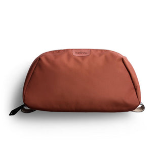 Bellroy Toiletry Kit Plus in rust color with smooth recycled fabric and minimalist design