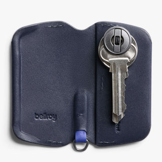 Bellroy Key Cover Third Edition in navy leather holding a single key with compact design